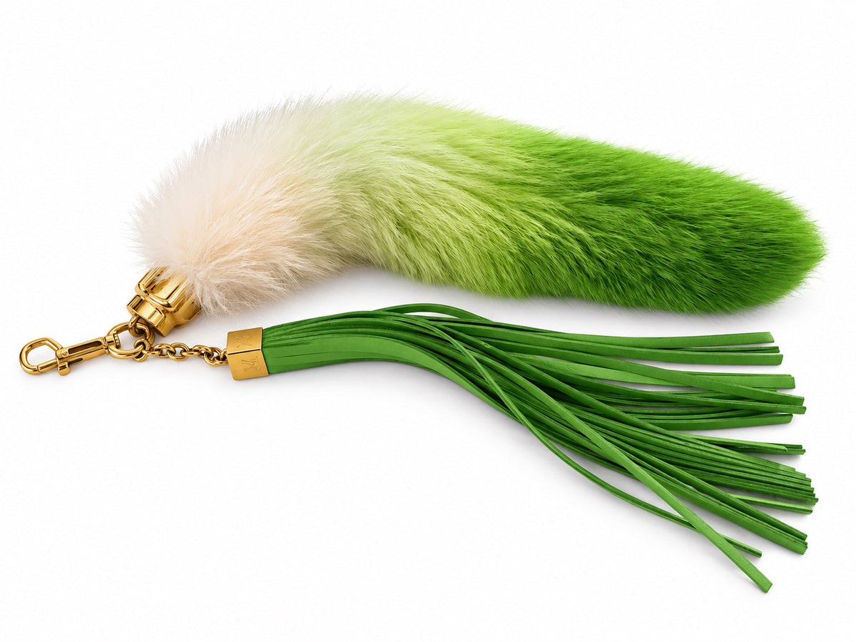 Louis Vuitton Foxy Vert bag charm in green and ivory fox fur on white background
